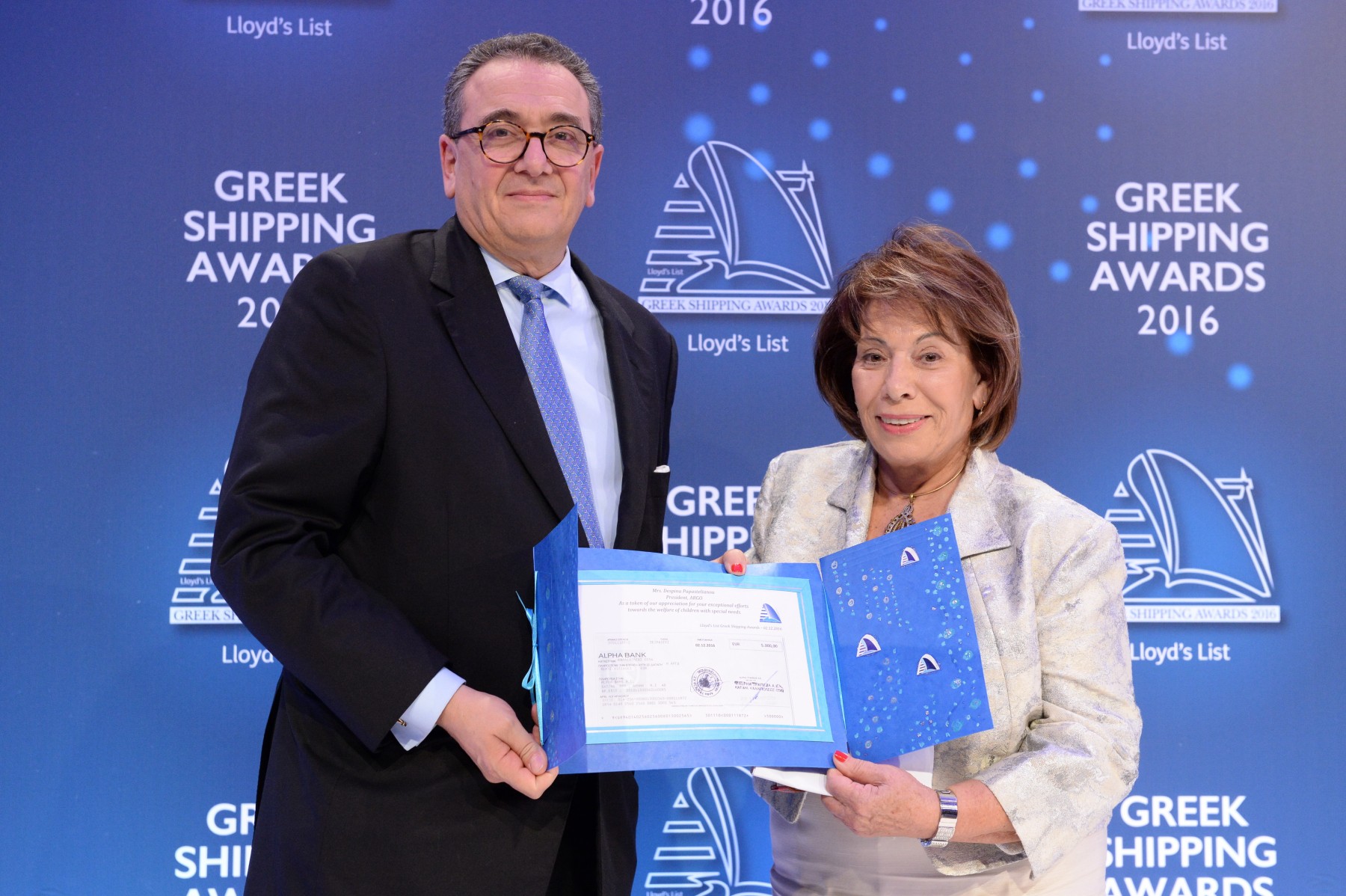 Mr. George D. Pateras of the Hellenic Chamber of Shipping presenting the Lloyd’s List Greek Shipping Awards annual donation to ARGO, accepted by Mrs. Despina Papastelianou