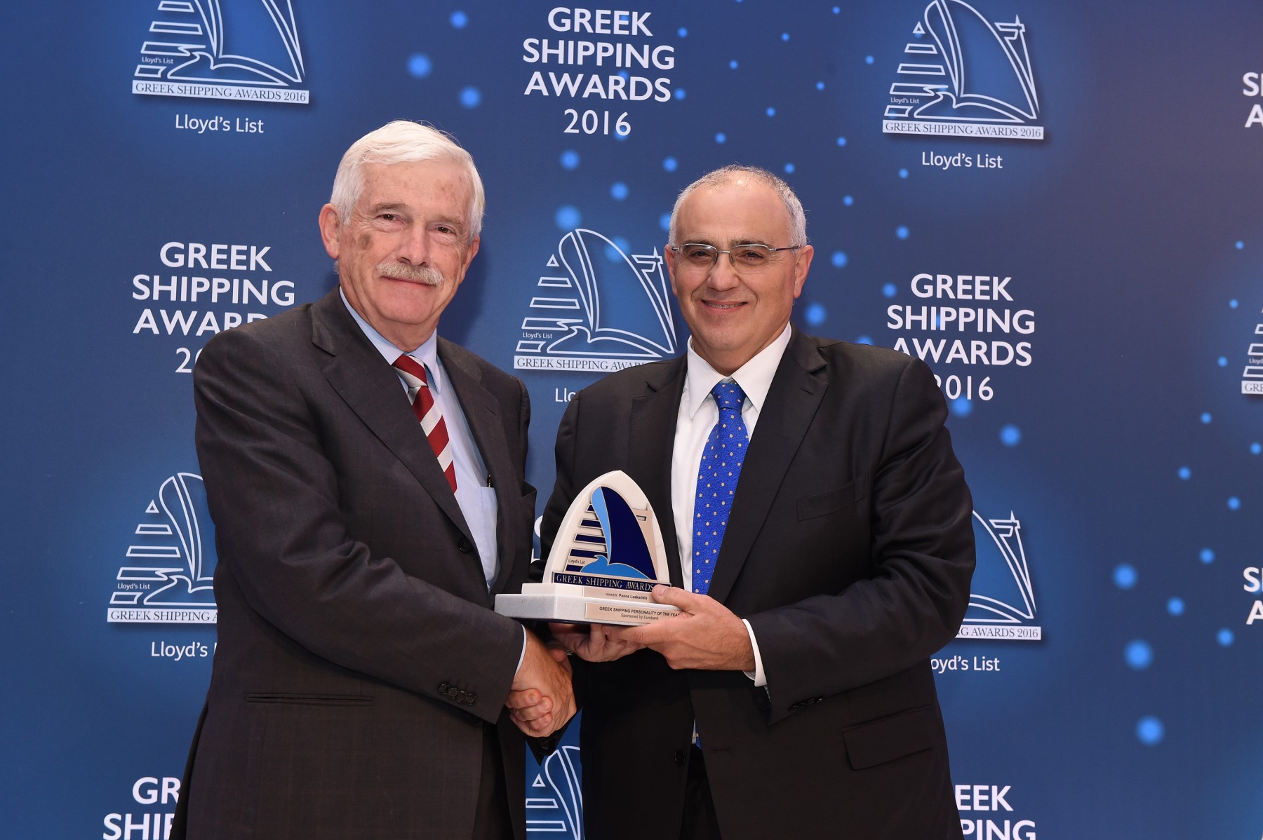 Mr. Panos Laskaridis accepting the Greek Shipping Personality of the Year Award from Mr. Nikolaos Karamouzis of sponsor Eurobank Group.