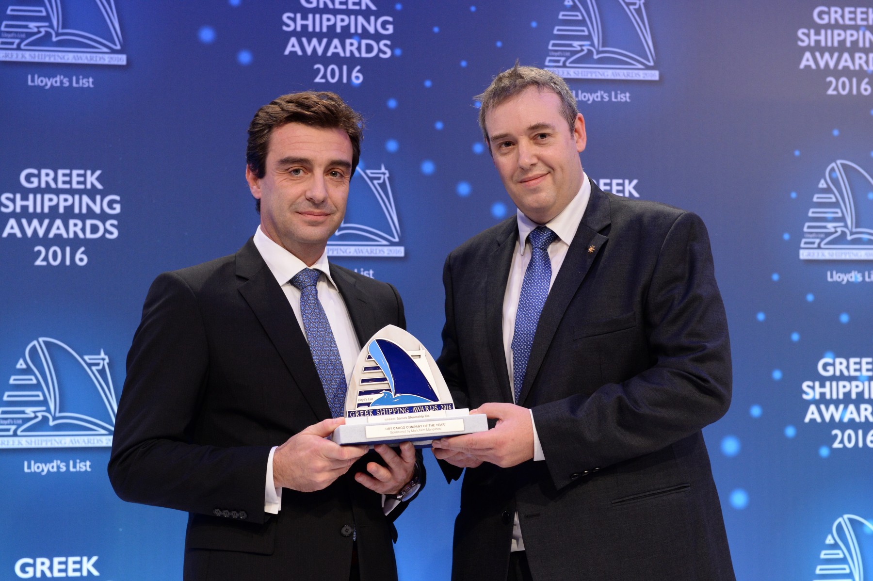 Mr. Anastasios Tzamouranis of Samos Steamship Co. accepting the Dry Cargo Company of the Year Award from Matthew More of sponsor Marichem Marigases.