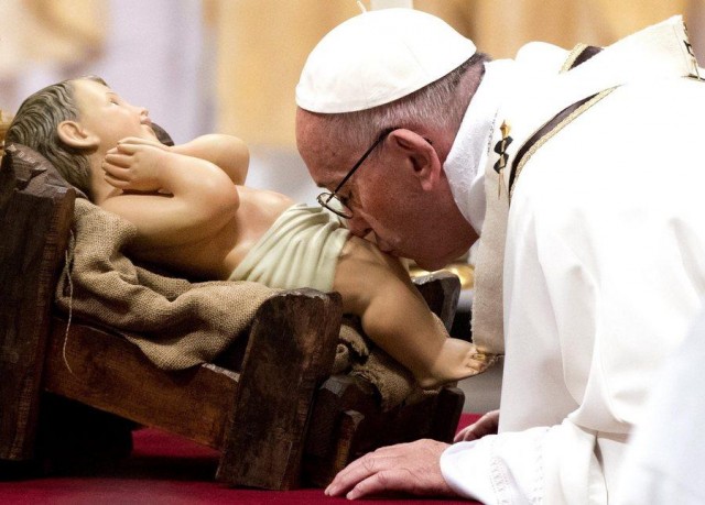 Pope Francis delivers a Christmas Mass at St. Peter's Basilica